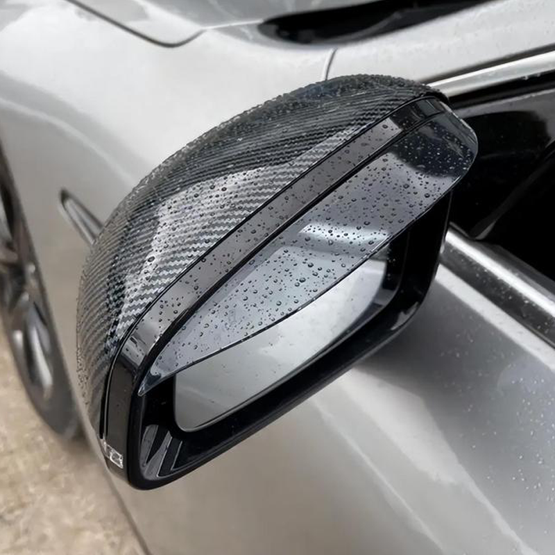Rearview mirror rain deflector